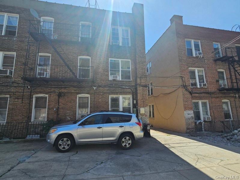 43-32 40th Street Queens, NY 11104 - Photo 12 of 14 a car parked in front of a building