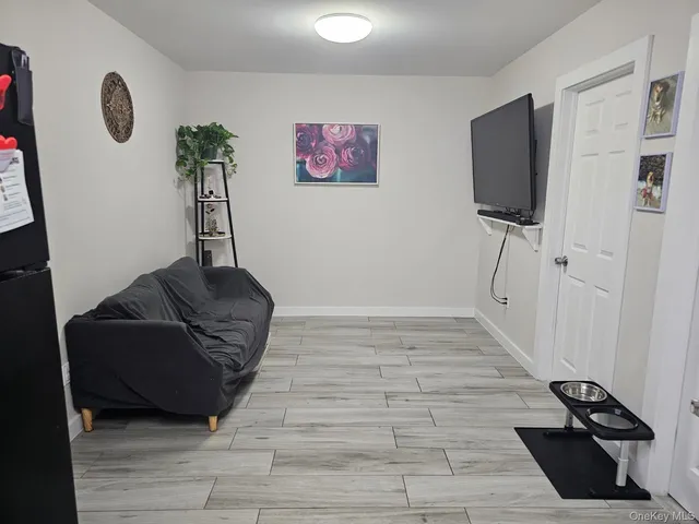 a view of a refrigerator in kitchen and wooden floor