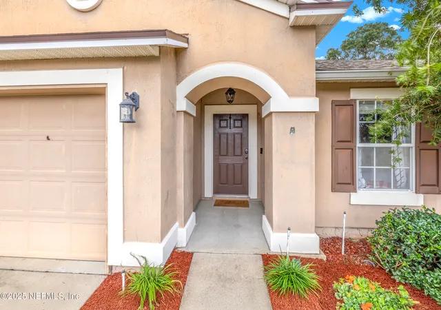 a front view of a house with a garage
