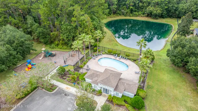 a view of a swimming pool with a patio