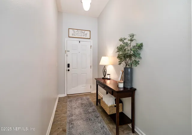 a living room with furniture and flat screen tv