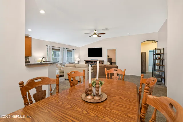 a dining room with furniture and window