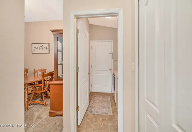a kitchen with granite countertop a refrigerator stove top oven a sink and dishwasher