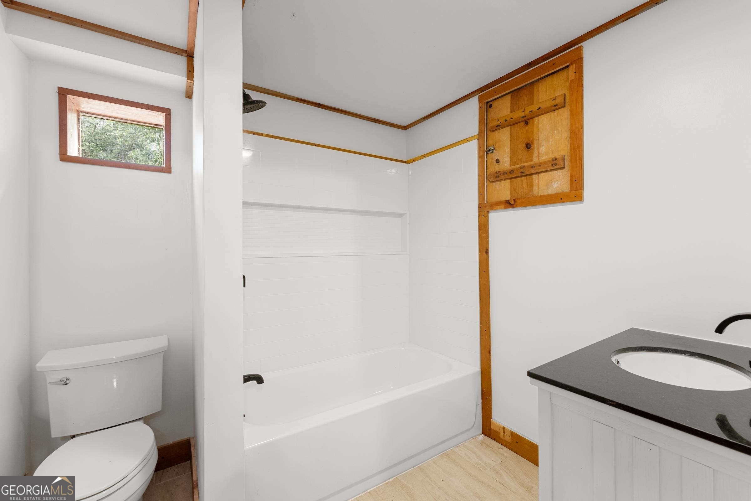 966 Wahoo Creek Road Murrayville, GA 30564 - Photo 30 of 81 a bathroom with a granite countertop sink toilet and shower
