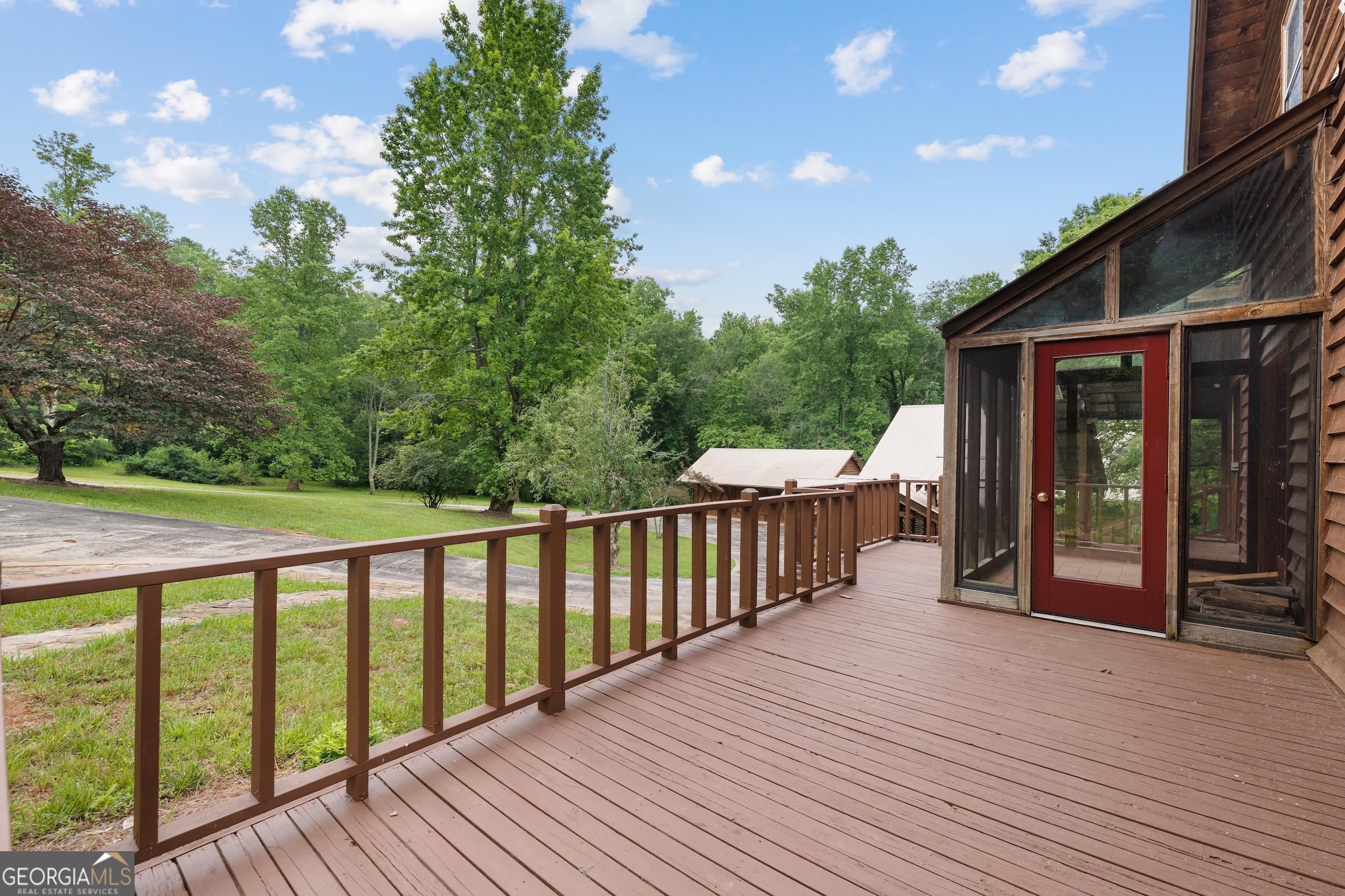966 Wahoo Creek Road Murrayville, GA 30564 - Photo 4 of 81 a balcony with wooden floor and fence
