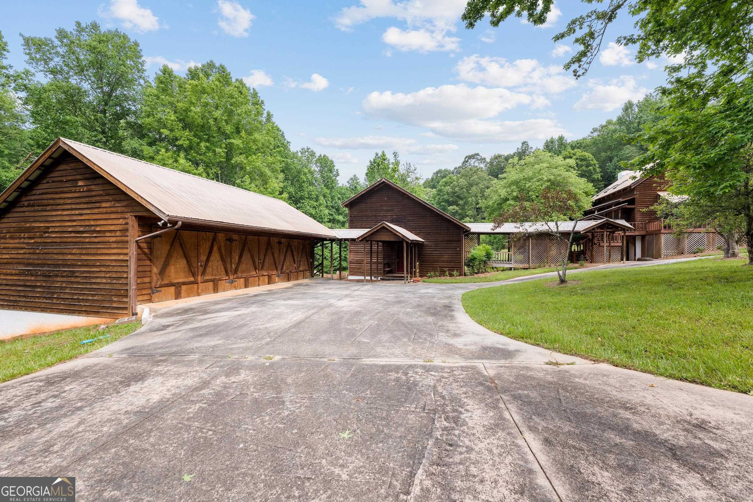 966 Wahoo Creek Road Murrayville, GA 30564 - Photo 54 of 81 a front view of a house with a yard and garage