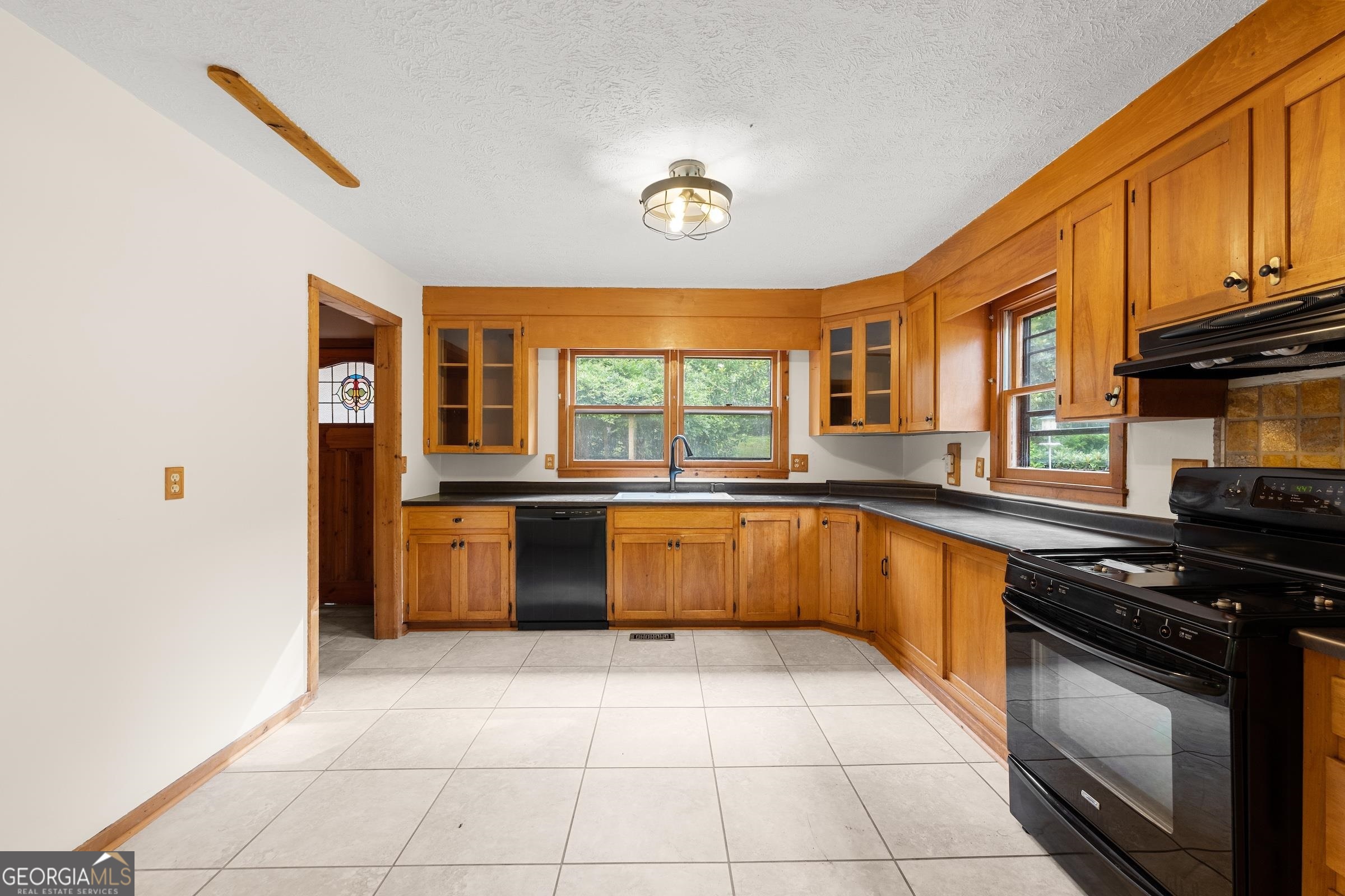 966 Wahoo Creek Road Murrayville, GA 30564 - Photo 7 of 81 a kitchen with stainless steel appliances granite countertop a stove a sink and a microwave