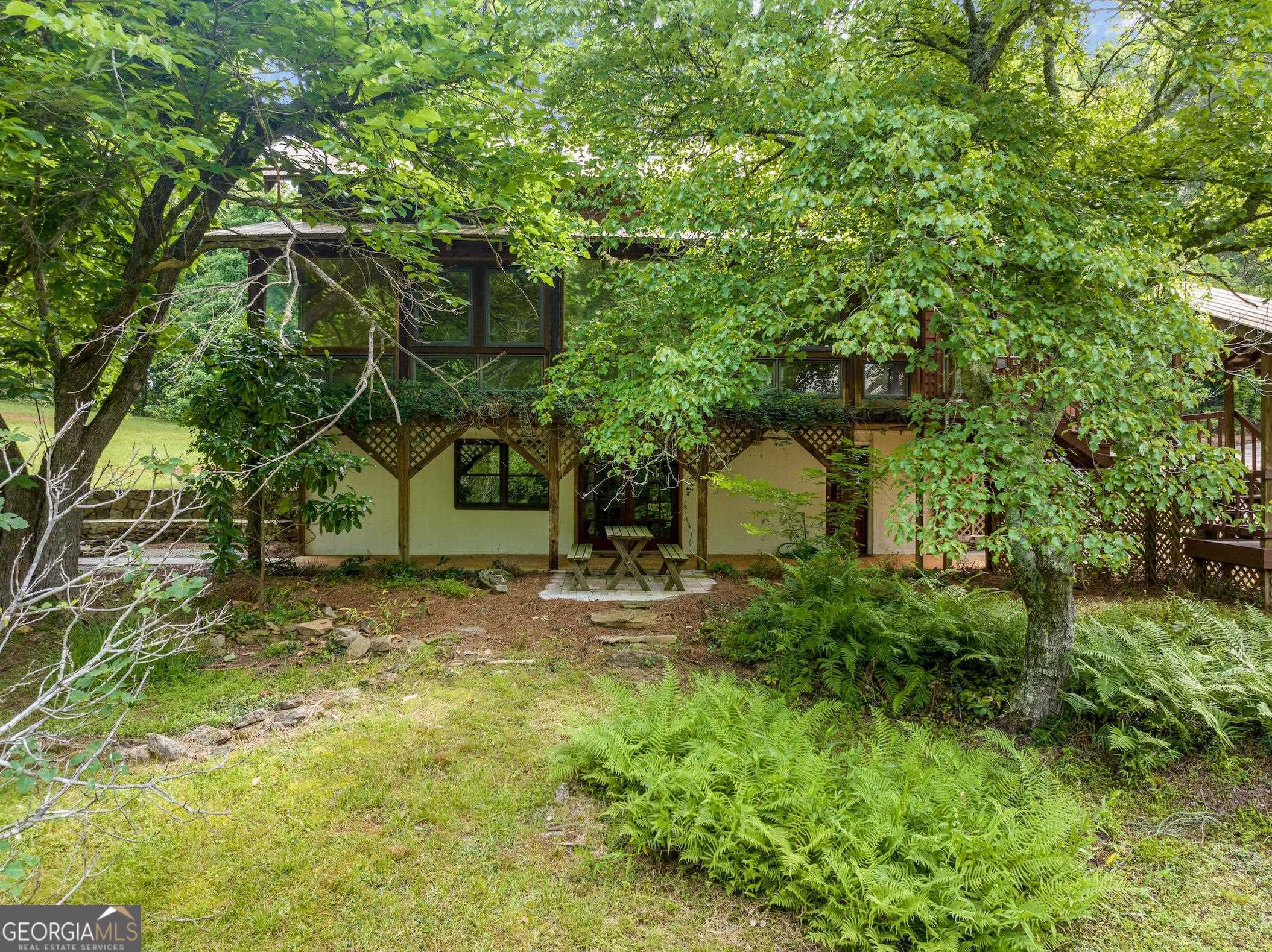 966 Wahoo Creek Road Murrayville, GA 30564 - Photo 73 of 81 a yellow house in middle of the forest