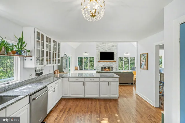 a living room with furniture fireplace and flat screen tv