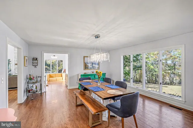 a bathroom with a sink a mirror and a window