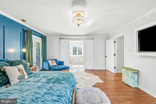 a view of walk in closet with clothes