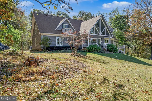 a view of house with yard