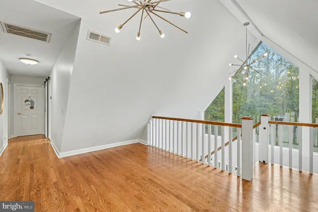 a room with a sink and large window