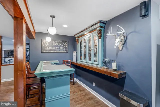 an aerial view of a house with a mountain