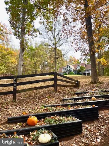 a view of swimming pool with a yard
