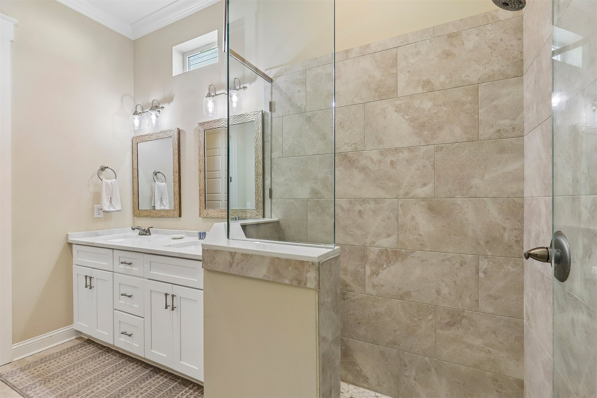 1012 White Street Fernandina Beach, FL 32034 - Photo 23 of 35 a bathroom with a double vanity sink a toilet a mirror and shower
