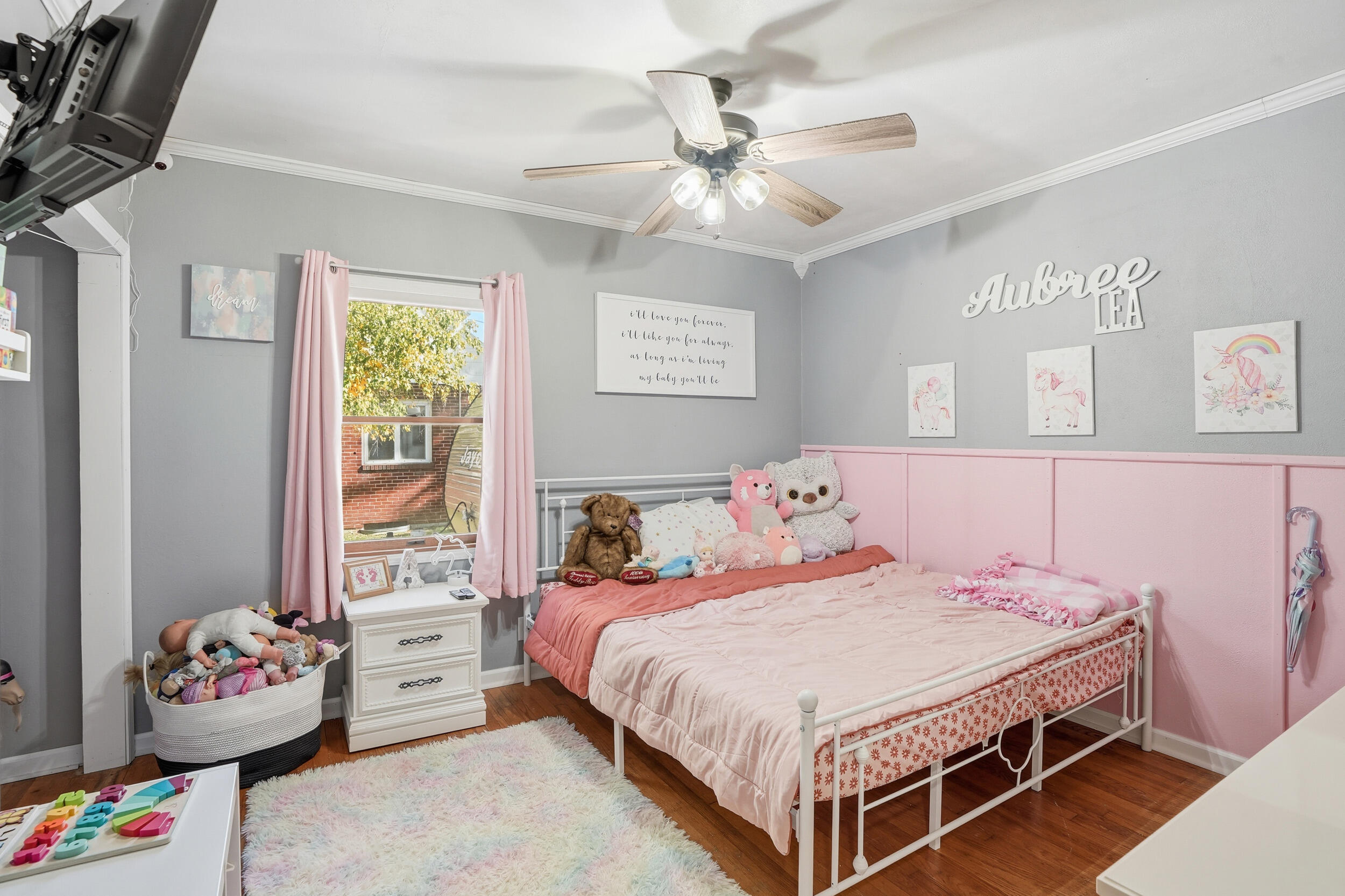 705 East Grace Street Rensselaer, IN 47978 - Photo 13 of 32 a bedroom with a bed and a chandelier