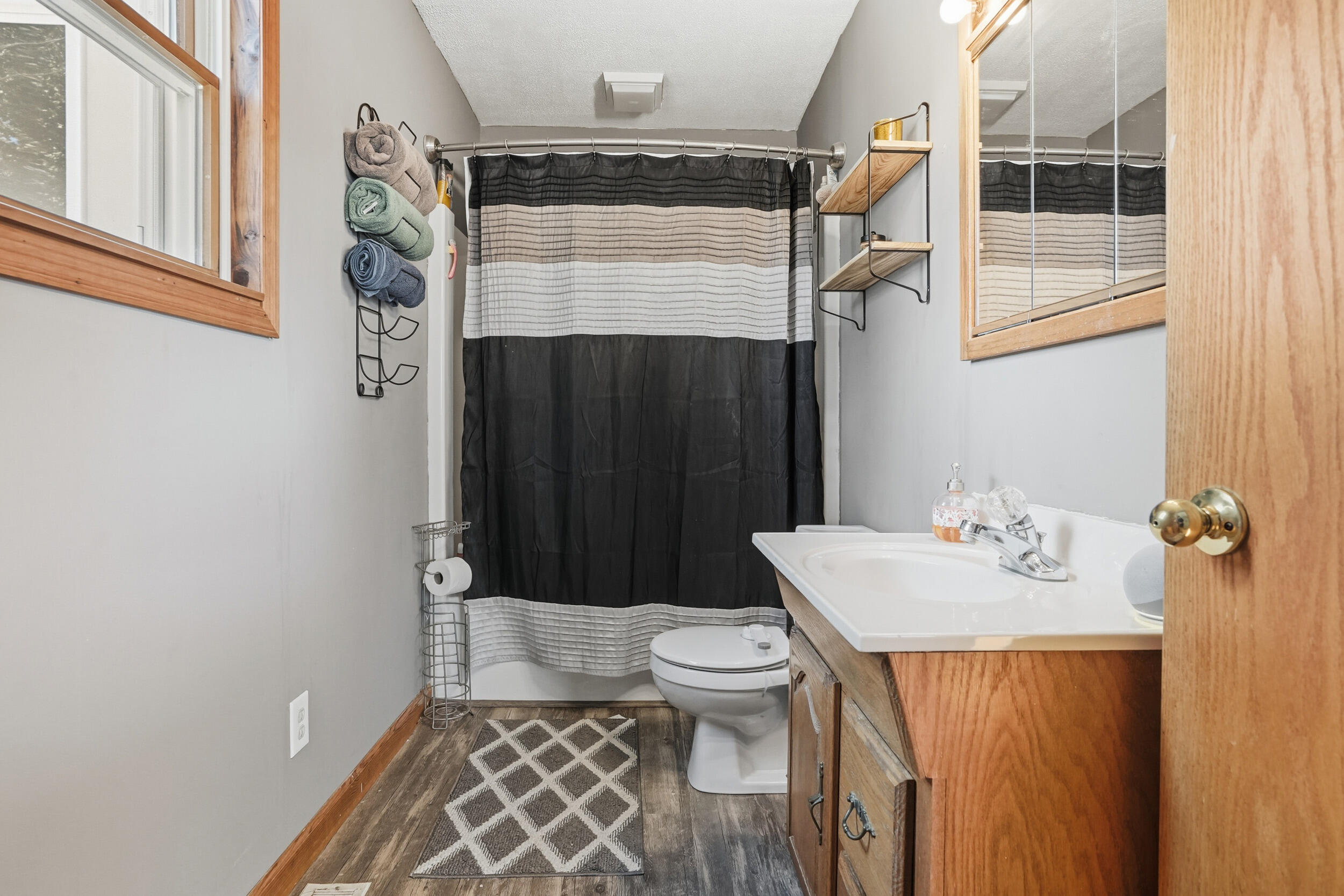 705 East Grace Street Rensselaer, IN 47978 - Photo 16 of 32 a bathroom with a sink toilet and shower