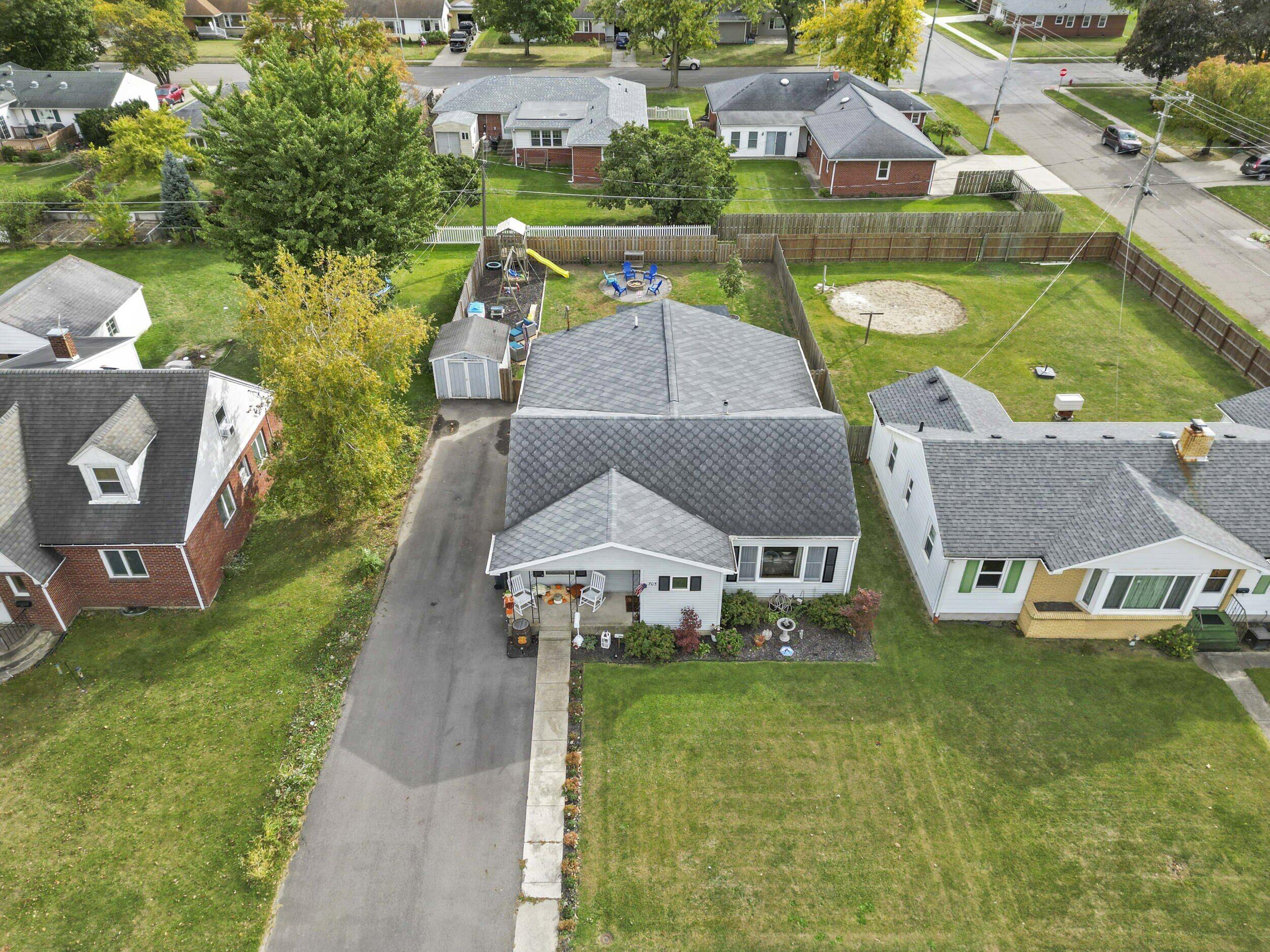 705 East Grace Street Rensselaer, IN 47978 - Photo 27 of 32 an aerial view of a house with swimming pool and outdoor space