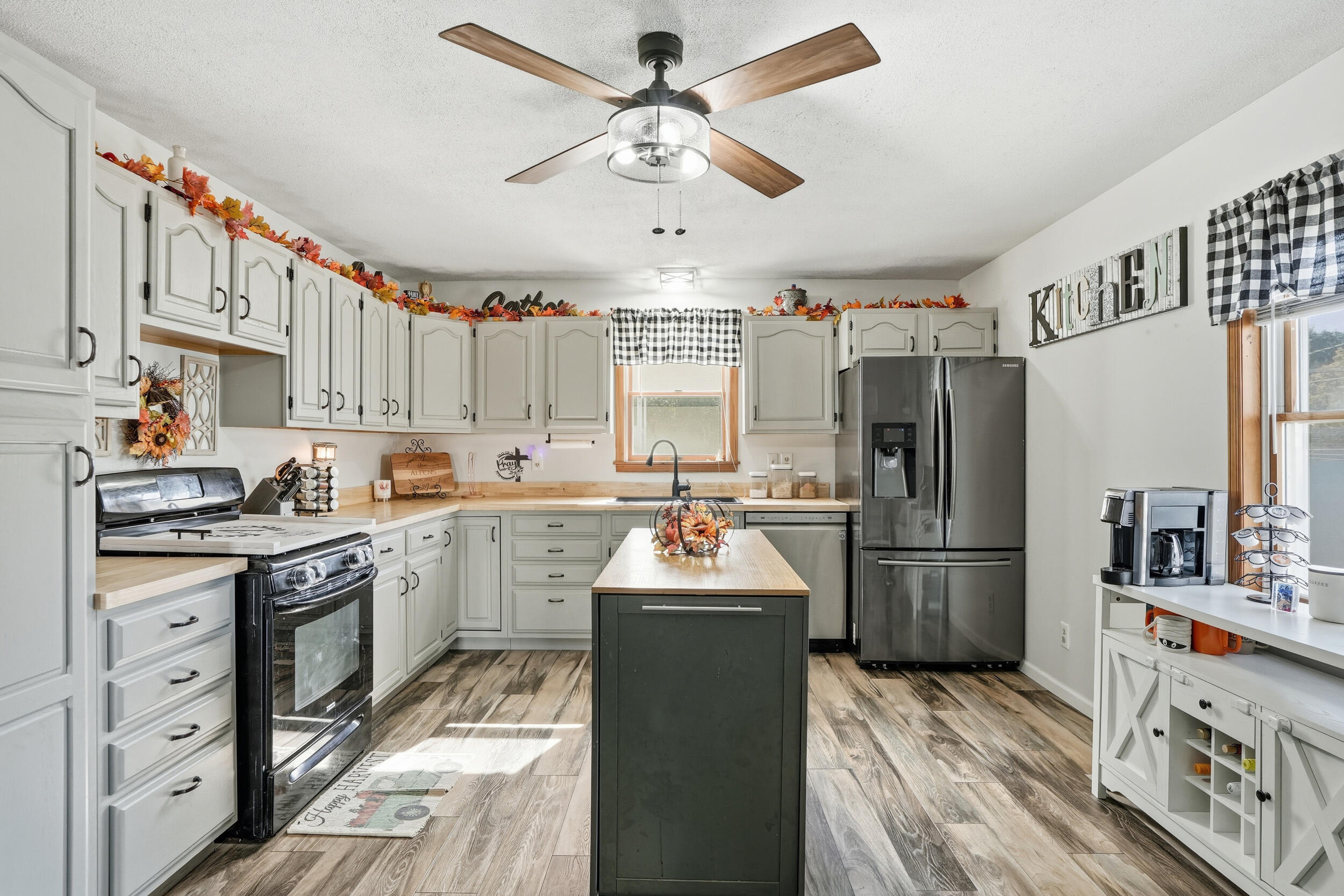 705 East Grace Street Rensselaer, IN 47978 - Photo 3 of 32 a kitchen with refrigerator cabinets and a sink