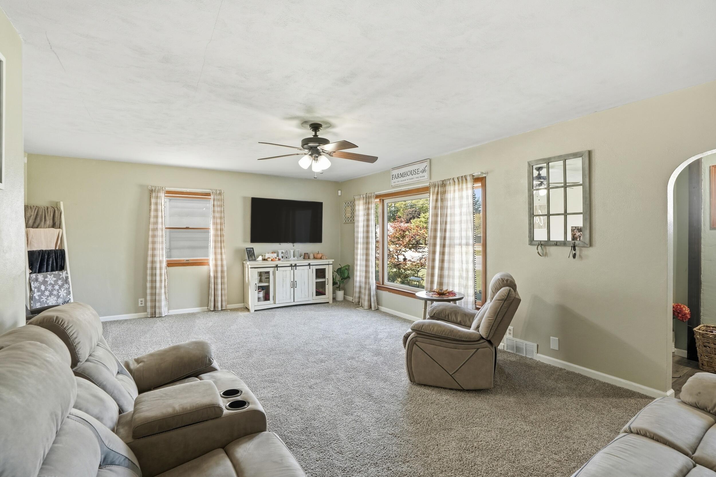 705 East Grace Street Rensselaer, IN 47978 - Photo 6 of 32 a living room with furniture and a flat screen tv