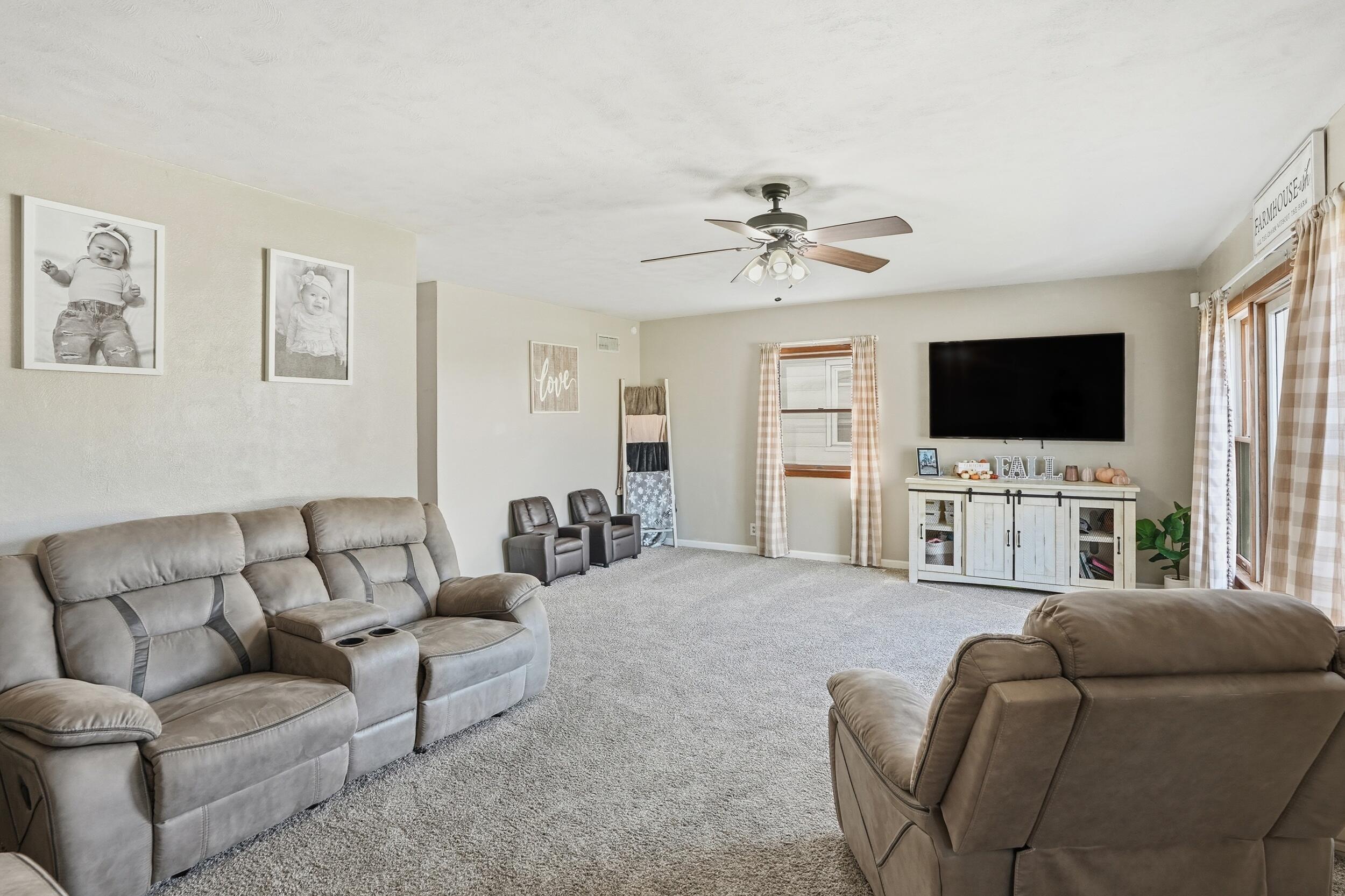 705 East Grace Street Rensselaer, IN 47978 - Photo 7 of 32 a living room with furniture and a flat screen tv