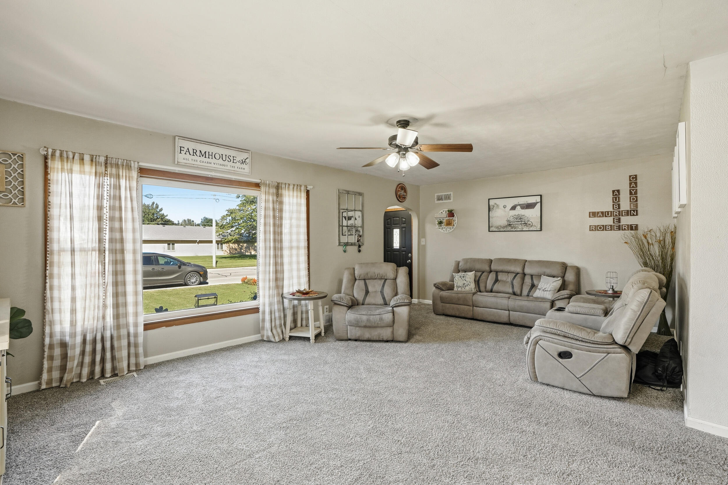 705 East Grace Street Rensselaer, IN 47978 - Photo 8 of 32 a living room with furniture and a large window