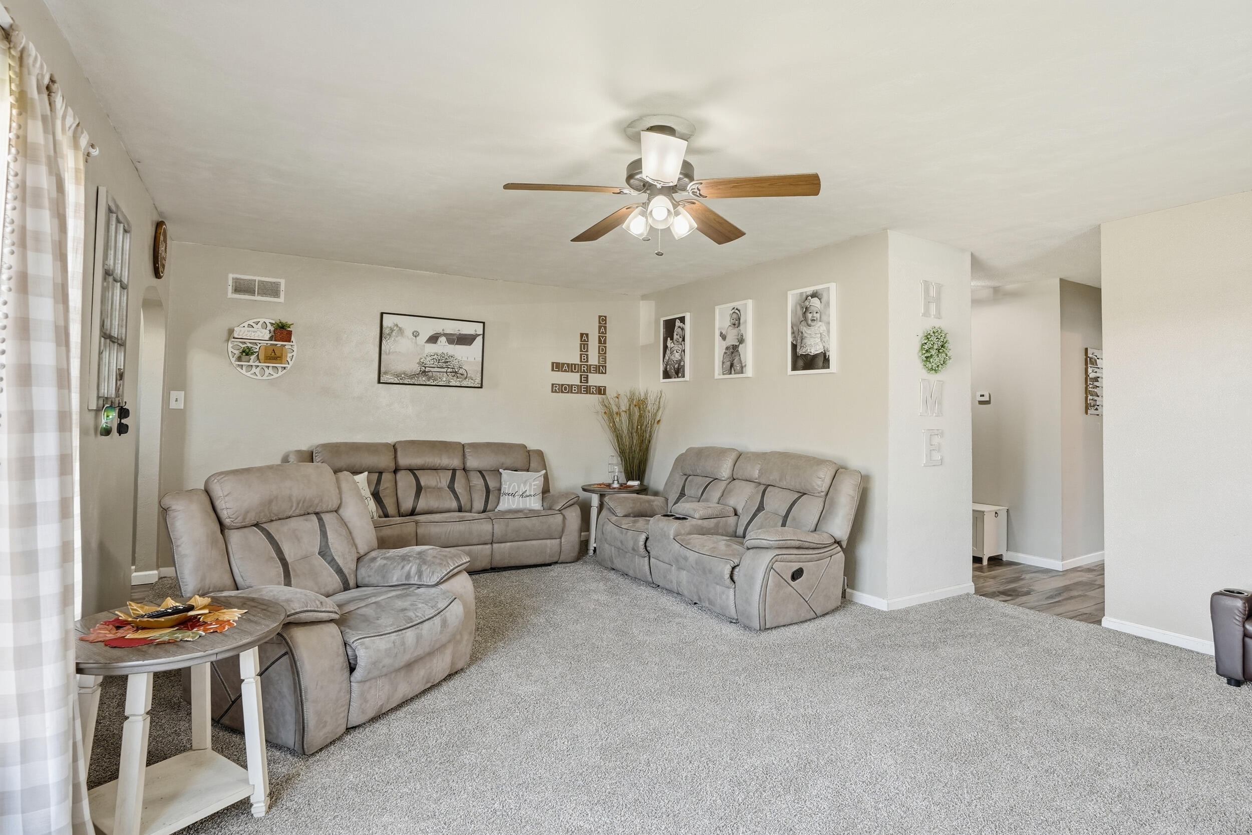 705 East Grace Street Rensselaer, IN 47978 - Photo 9 of 32 a living room with furniture and a chandelier