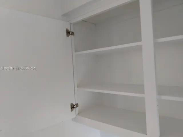a close view of laundry room with a washer and dryer