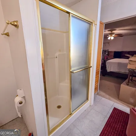 a bathroom with a glass shower door