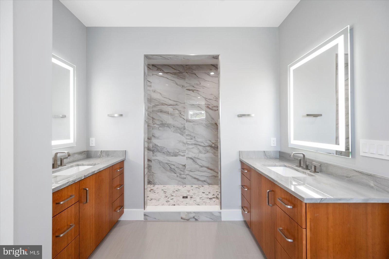 12300 Snug Harbor Road Berlin, MD 21811 - Photo 14 of 28 a bathroom with a sink double vanity mirror and a bathtub