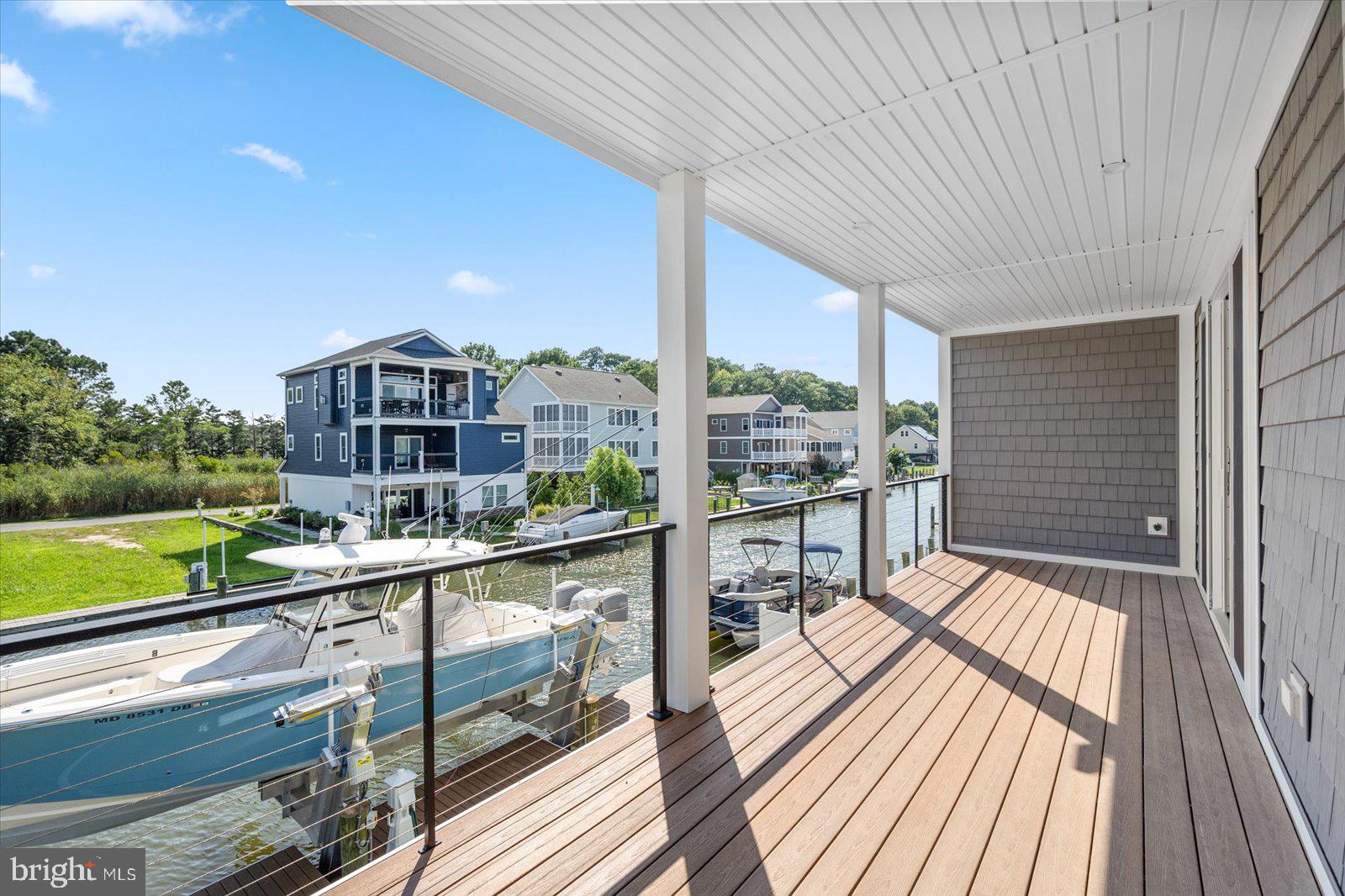 12300 Snug Harbor Road Berlin, MD 21811 - Photo 21 of 28 a view of a balcony with wooden floor