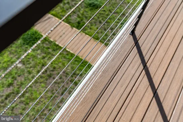 a balcony with wooden floor and city view