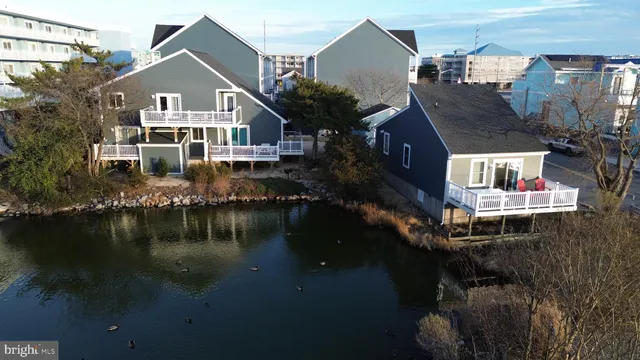 a front view of a house with a lake view