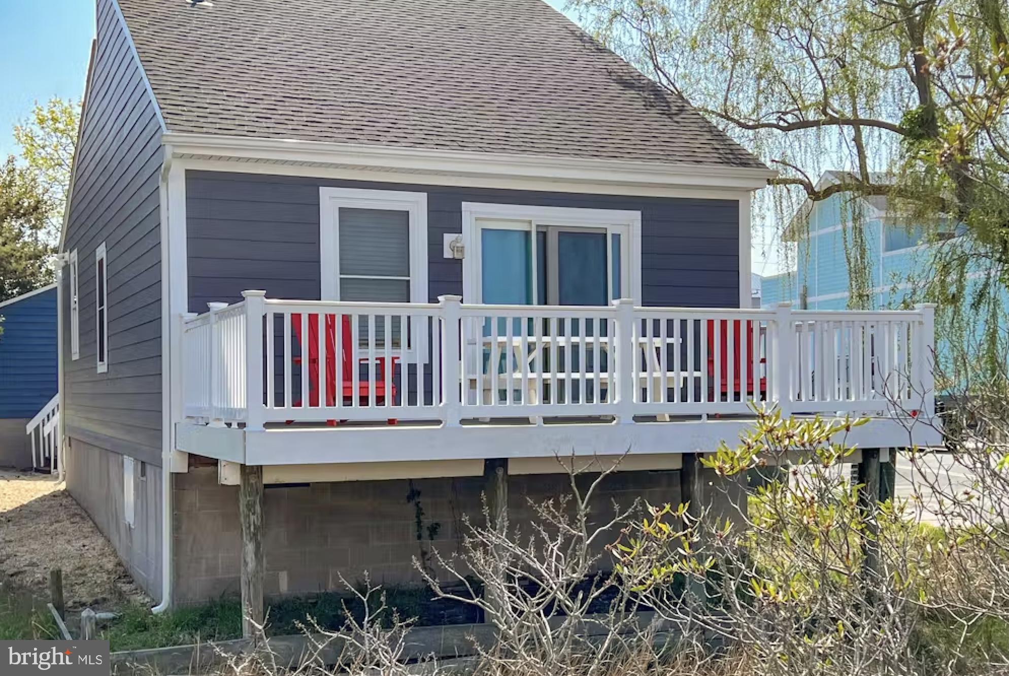 114 75th Street Ocean City, MD 21842 - Photo 5 of 11 a view of a wooden deck with a bench