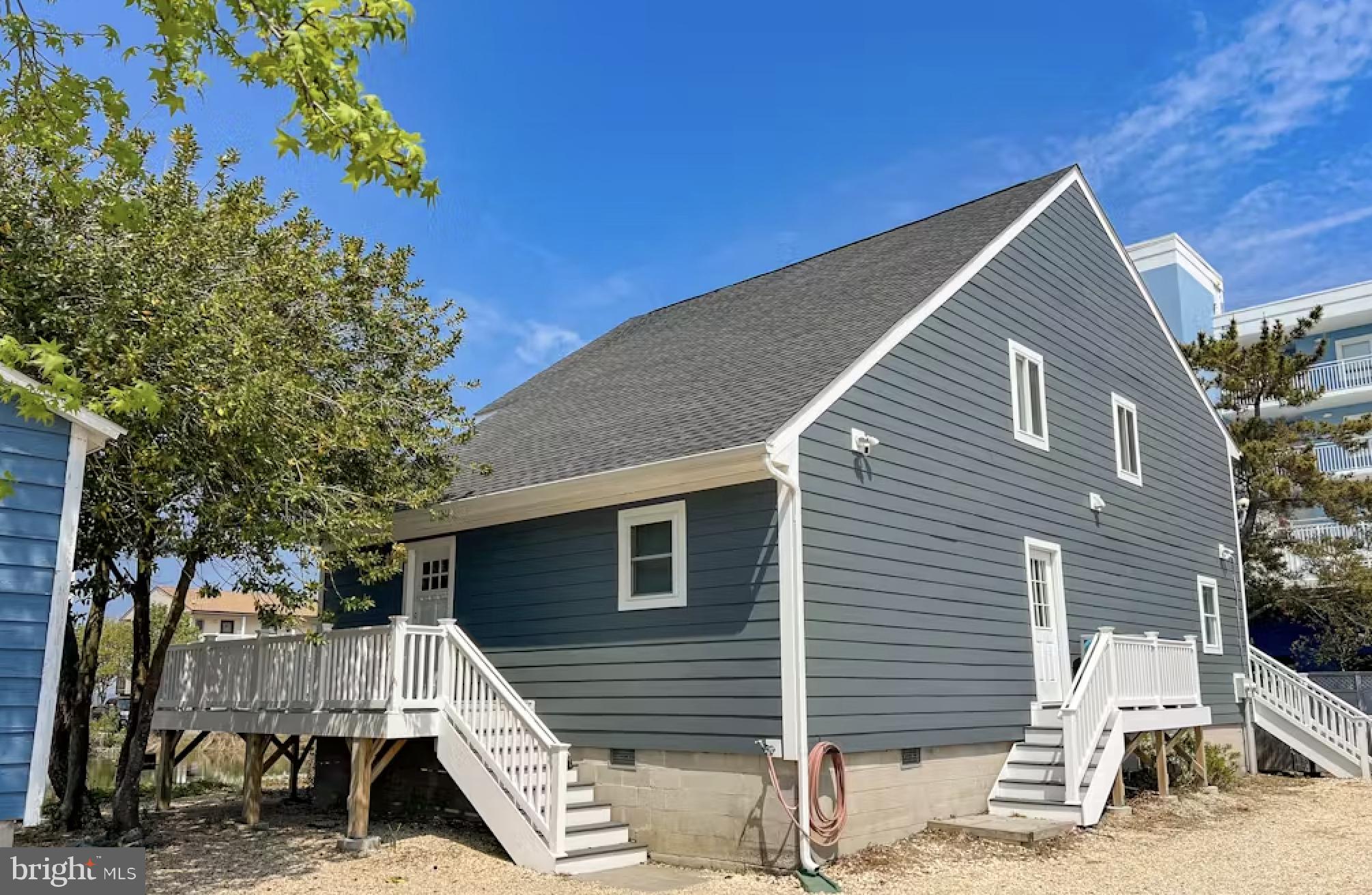 114 75th Street Ocean City, MD 21842 - Photo 8 of 11 a view of a house with a yard