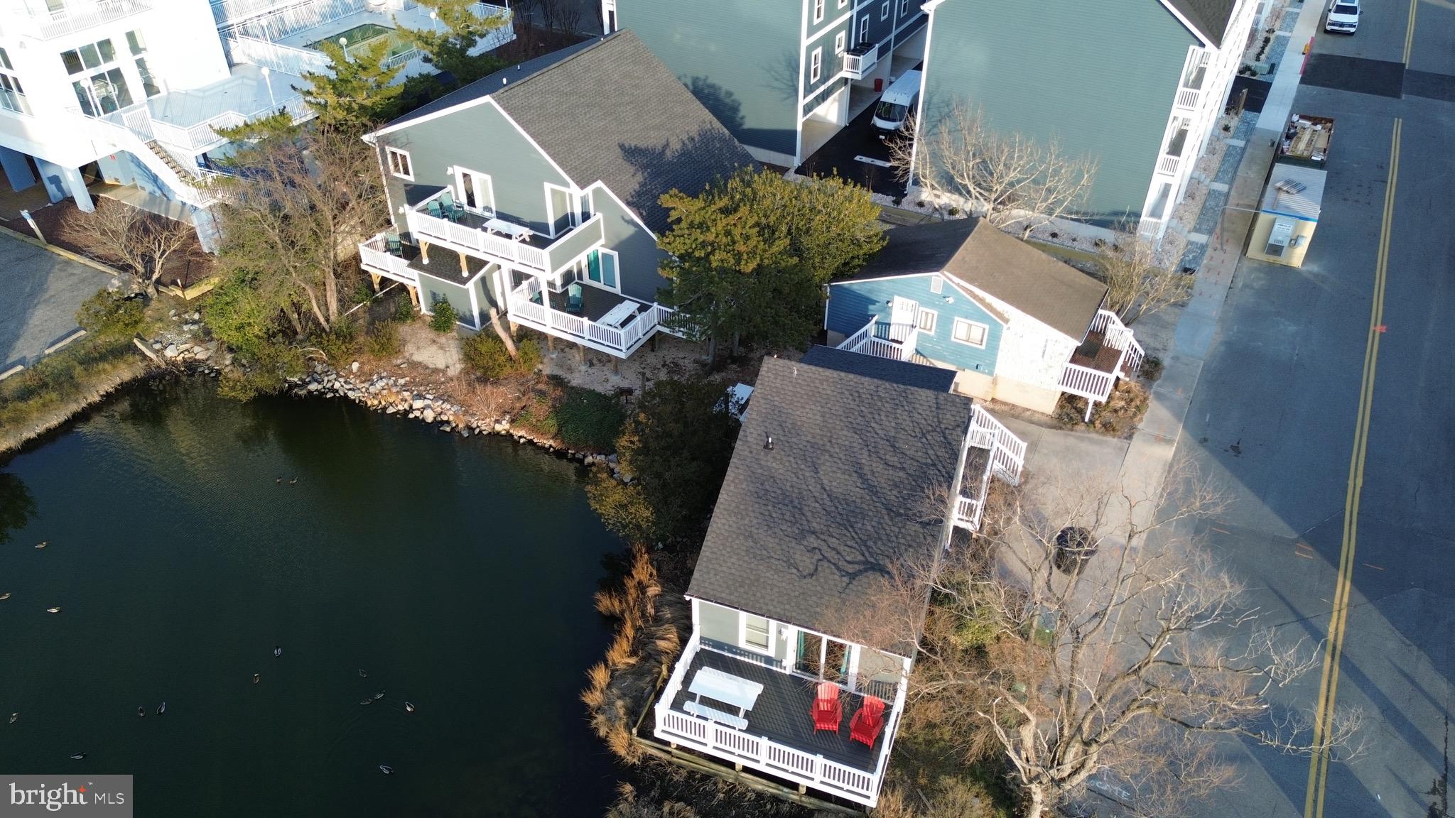 114 75th Street Ocean City, MD 21842 - Photo 9 of 11 an aerial view of residential houses with outdoor space and swimming pool