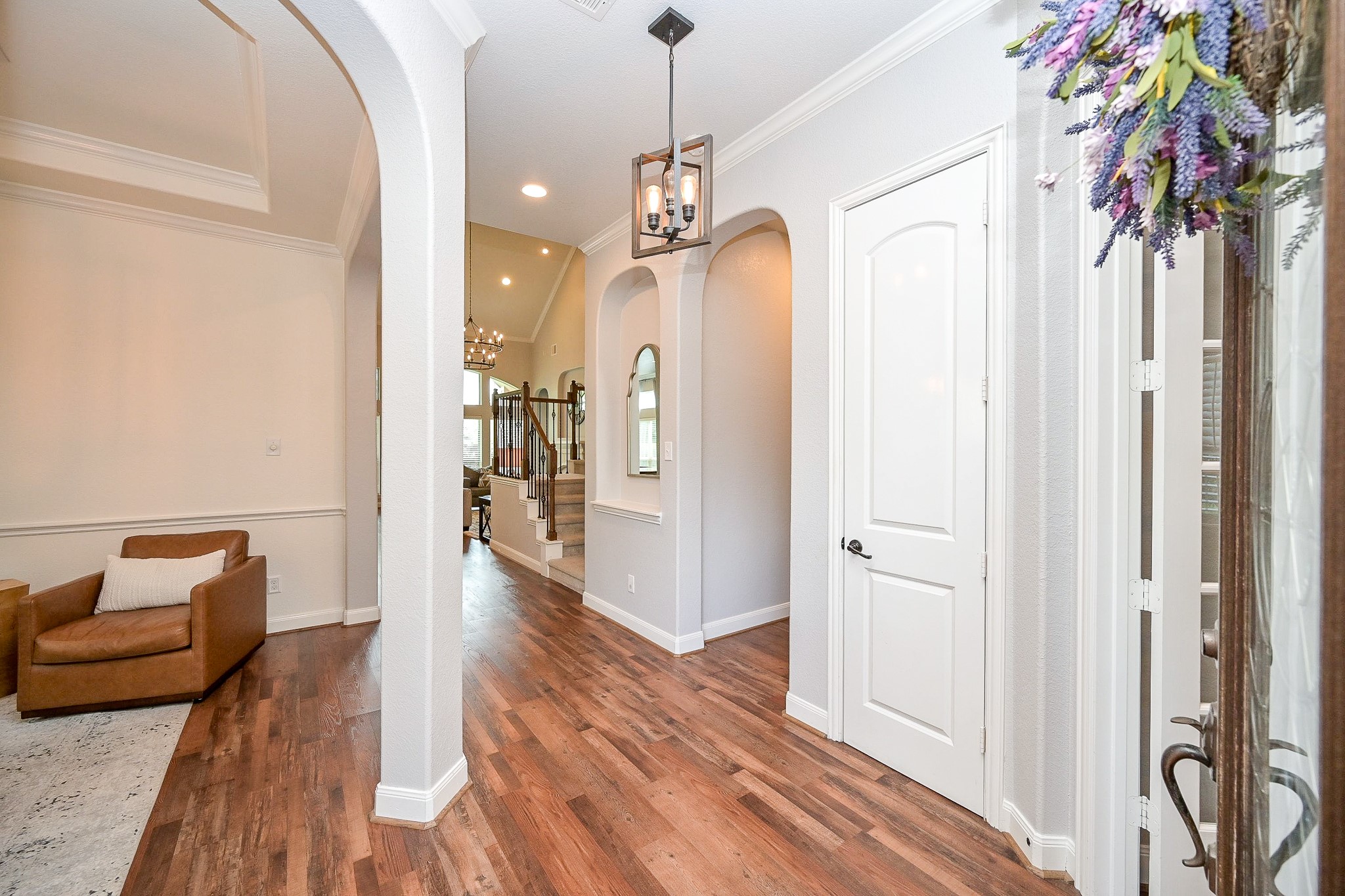 11 South Victoriana Circle Spring, TX 77389 - Photo 4 of 38 a very nice looking room with wooden floor and a bathroom