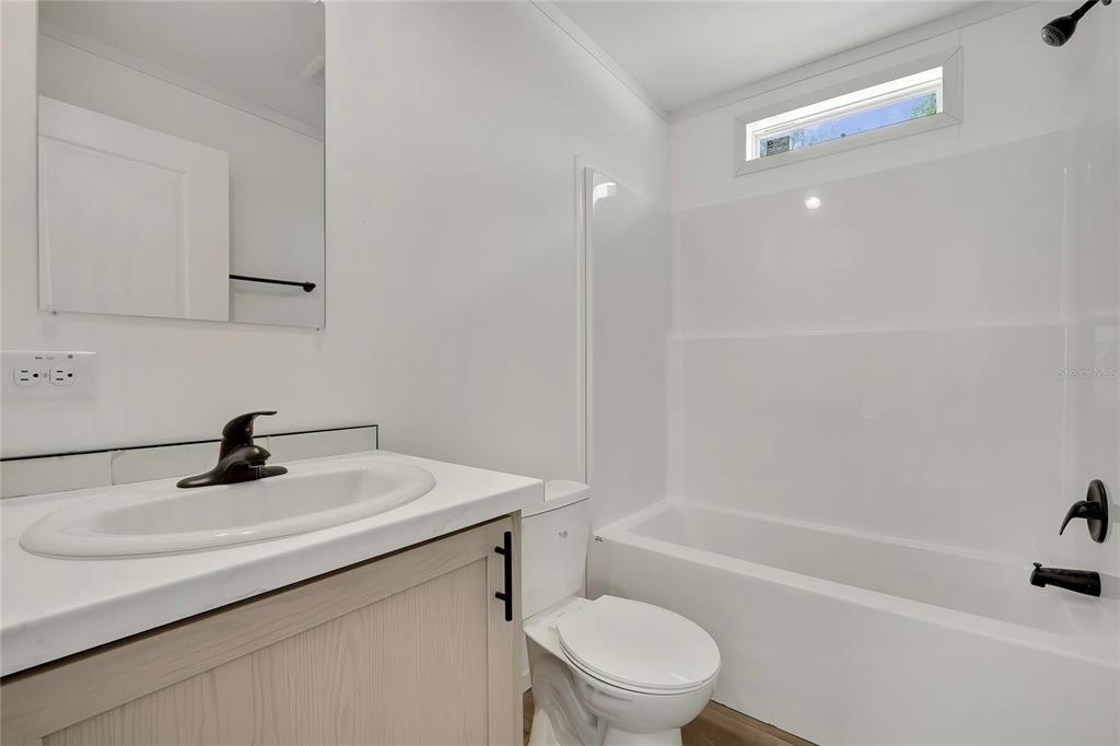 5342 South Isabel Terrace Homosassa, FL 34446 - Photo 20 of 23 a bathroom with a sink a toilet and shower