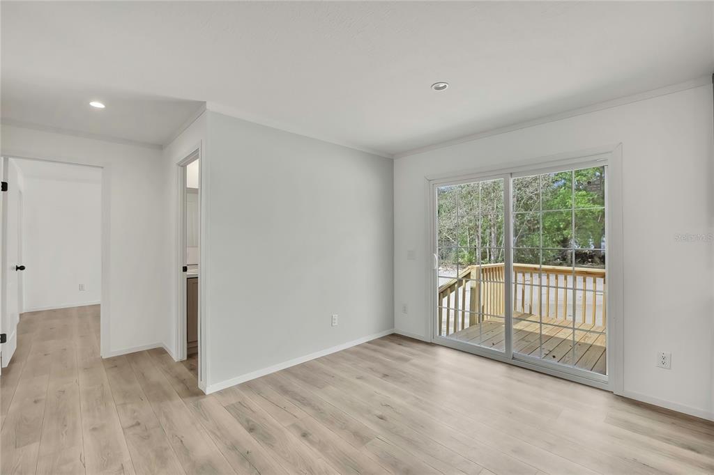 5342 South Isabel Terrace Homosassa, FL 34446 - Photo 9 of 23 a view of a livingroom with wooden floor and a window