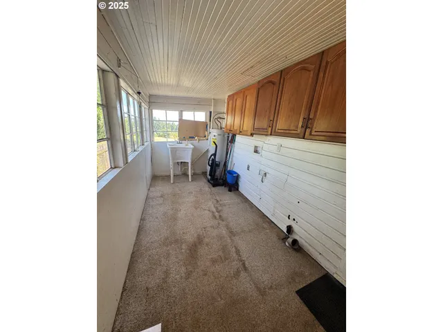 a view of balcony with wooden floor