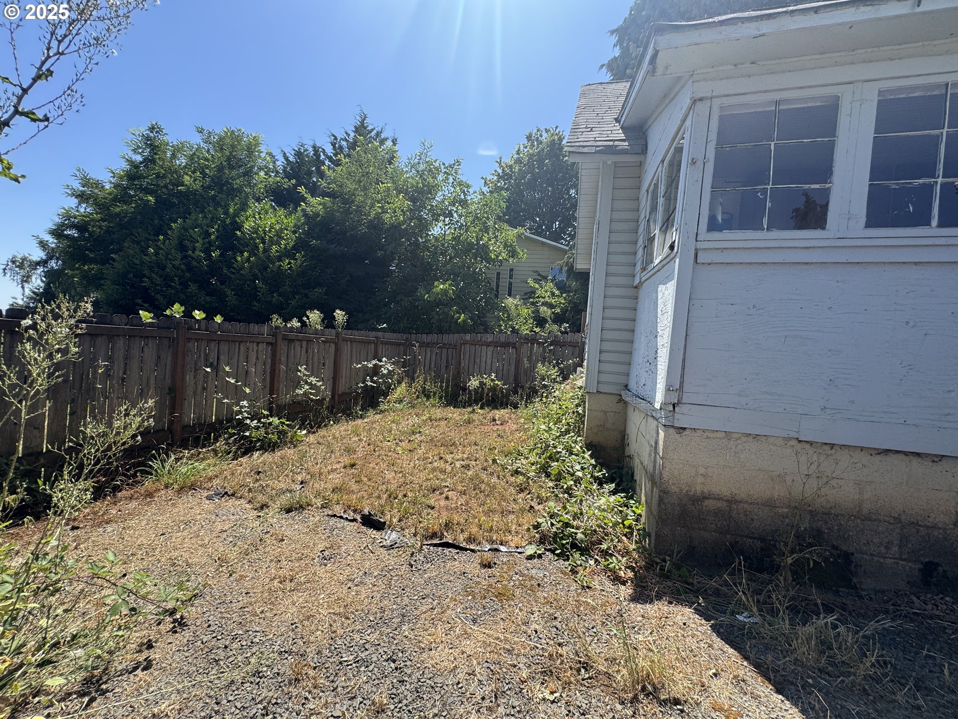 35092 Pittsburg Road St. Helens, OR 97051 - Photo 26 of 35 a view of a yard with plants and wooden fence