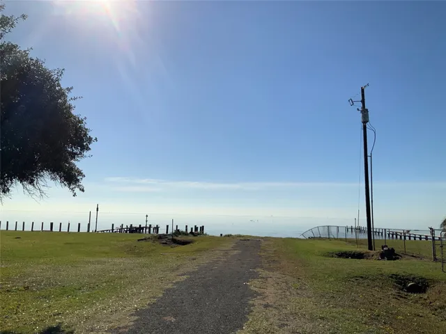 a view of a room with a kitchen