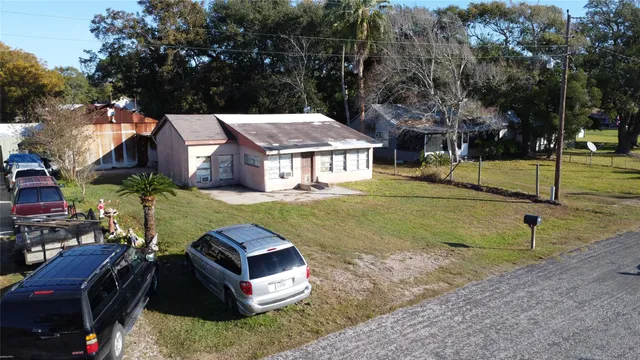 a view of a livingroom with furniture and staircase