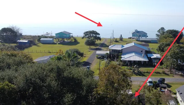 a kitchen with furniture wooden floor and a dining table