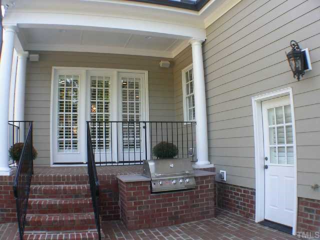 1922 Kirkwood Ridge Drive Raleigh, NC 27612 - Photo 11 of 12 a front view of a house with a porch