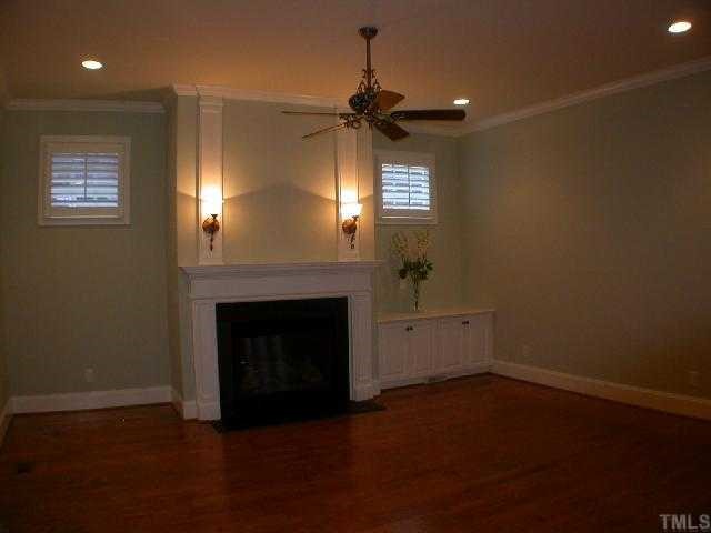 1922 Kirkwood Ridge Drive Raleigh, NC 27612 - Photo 8 of 12 a view of empty room with a fireplace