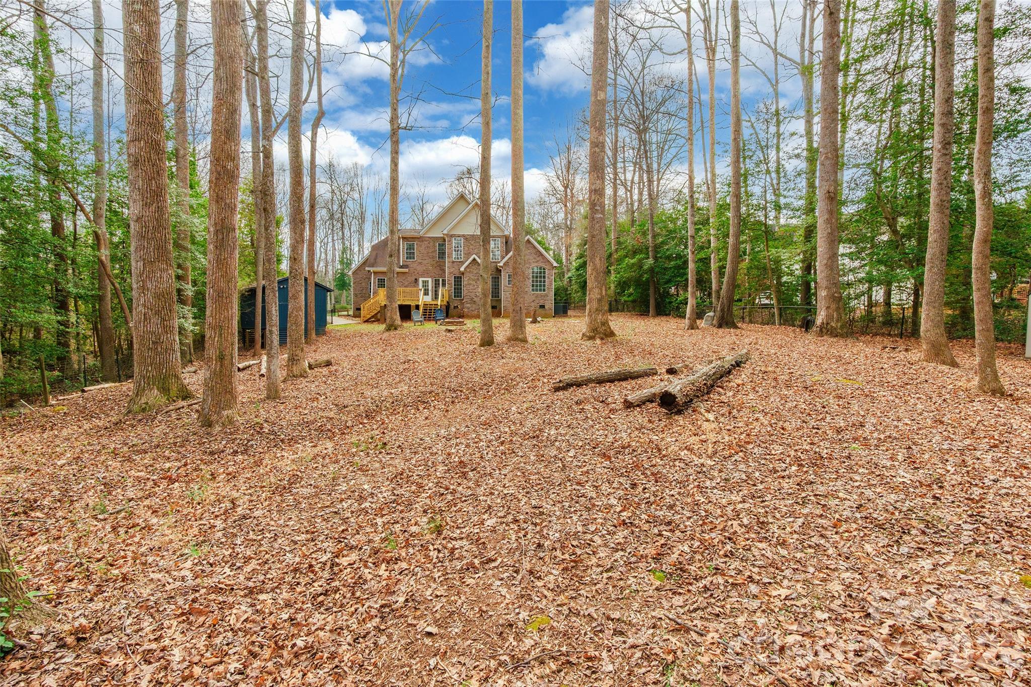321 Forbes Court Clover, SC 29710 - Photo 28 of 31 a row of trees with a house in the background