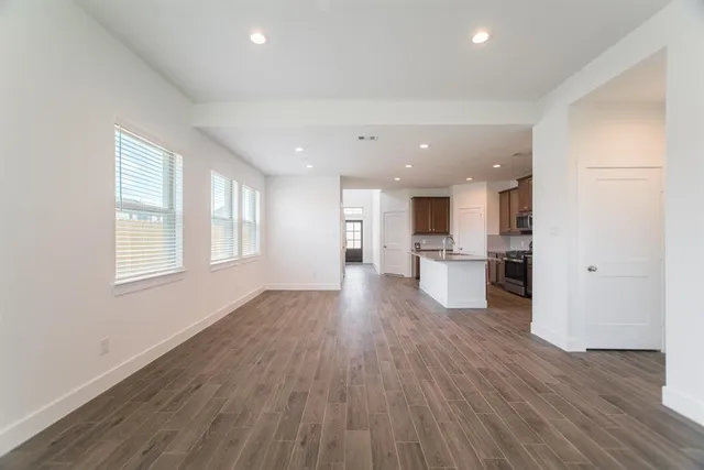 a view of kitchen with cabinets and wooden floor