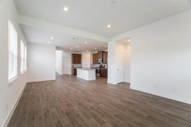 a view of kitchen with wooden floor